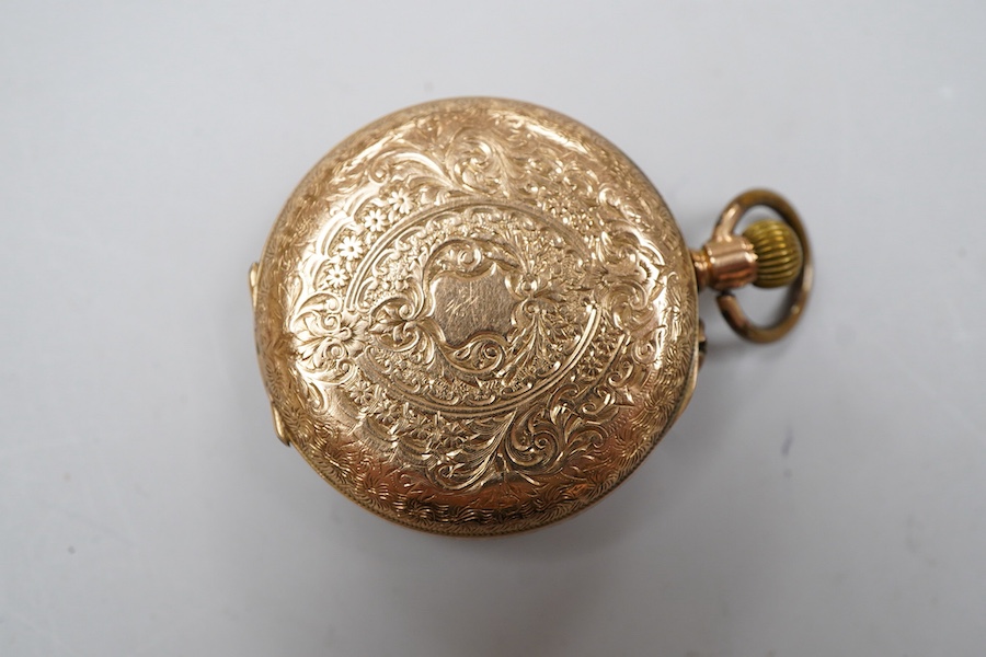 A lady's early 20th century 14K open faced fob watch, with Roman dial and gilt metal dust cover, gross weight 36 grams (dial cracked).